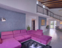 a living room with purple walls